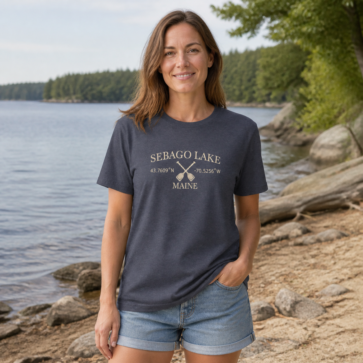 Woman wearing the Sebago Lake Coordinates and Paddles women’s relaxed T-shirt in Heather Navy