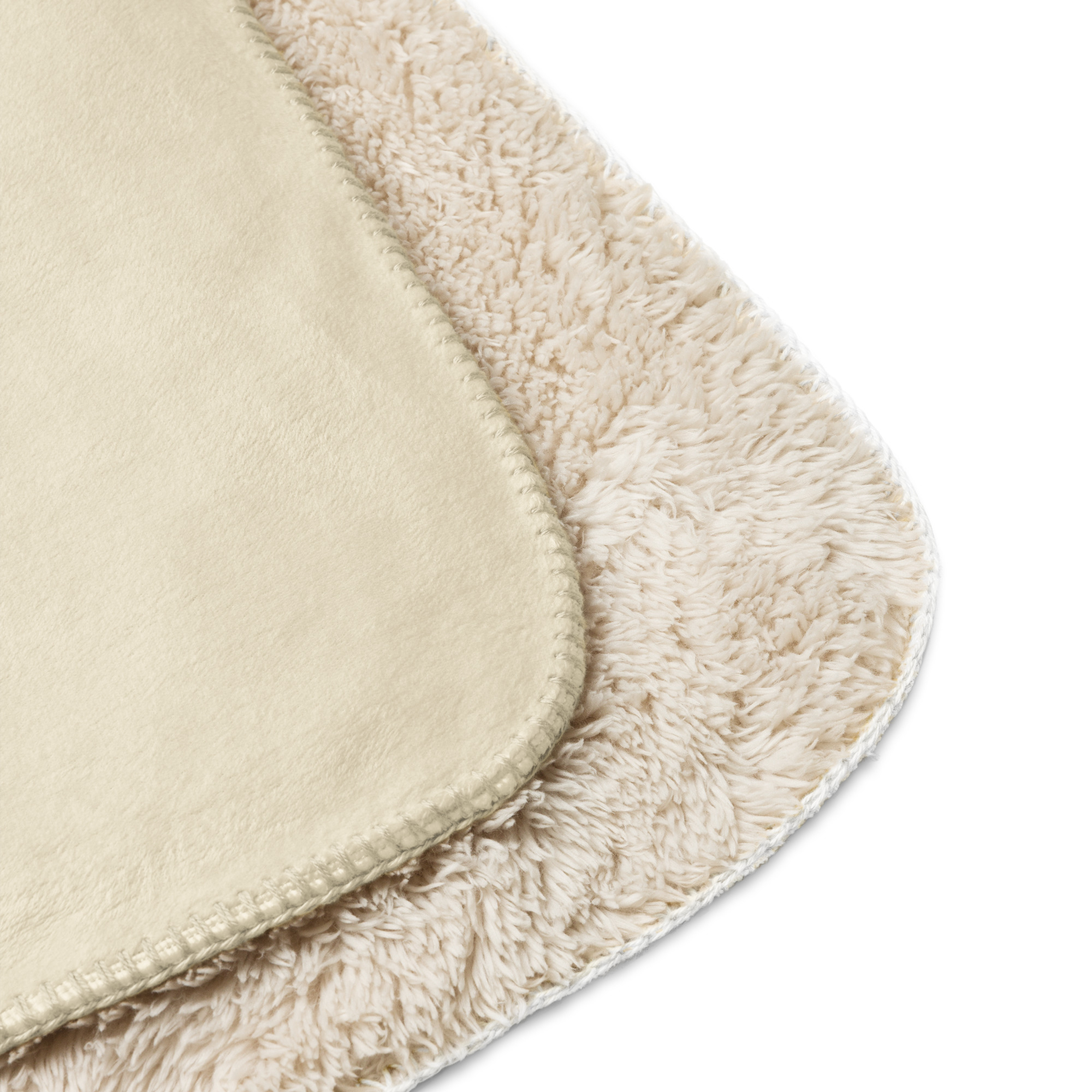 Smooth cream front and fluffy sherpa backing close-up