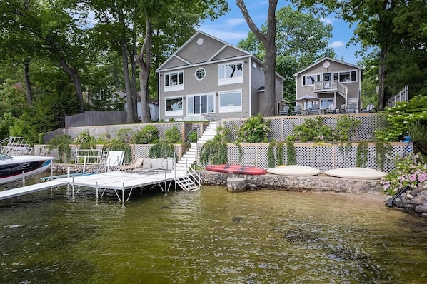 A house with a dock and outdoor seating area.