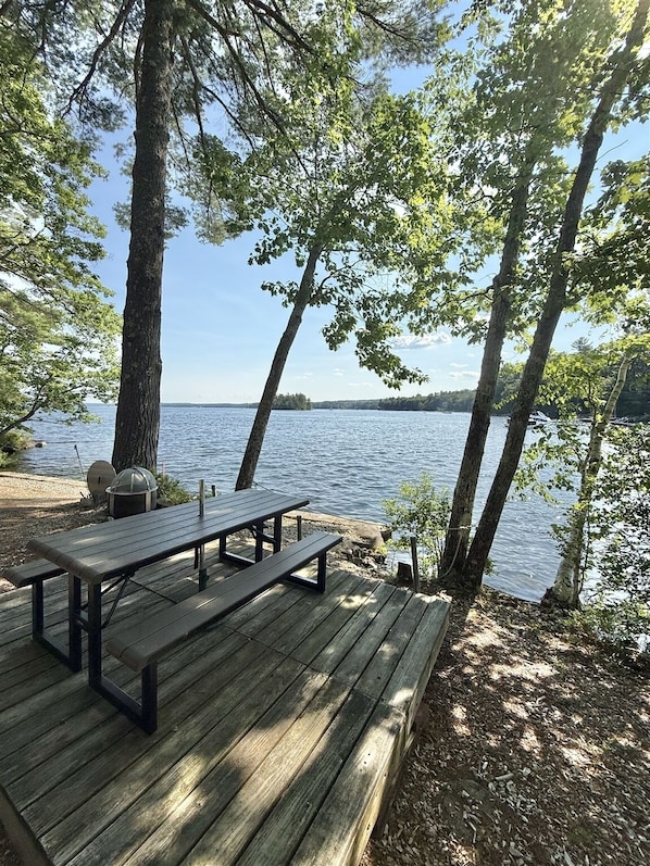 Lake-facing deck at the Sebago shoreline cottage